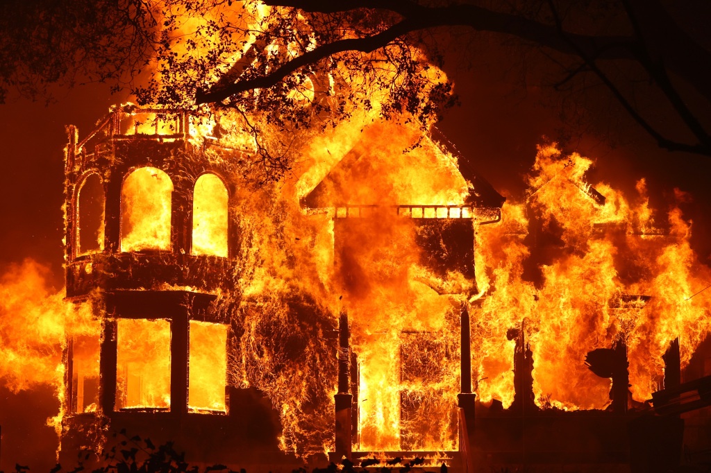 ST. HELENA, CALIFORNIA - SEPTEMBER 27: The Glass Mountain Inn burns as the Glass Fire moves through the area on September 27, 2020 in St. Helena, California. The fast moving Glass fire has burned over 1,000 acres and has destroyed homes. Much of Northern California is under a red flag warning for high fire danger through Monday evening. (Photo by Justin Sullivan/Getty Images)