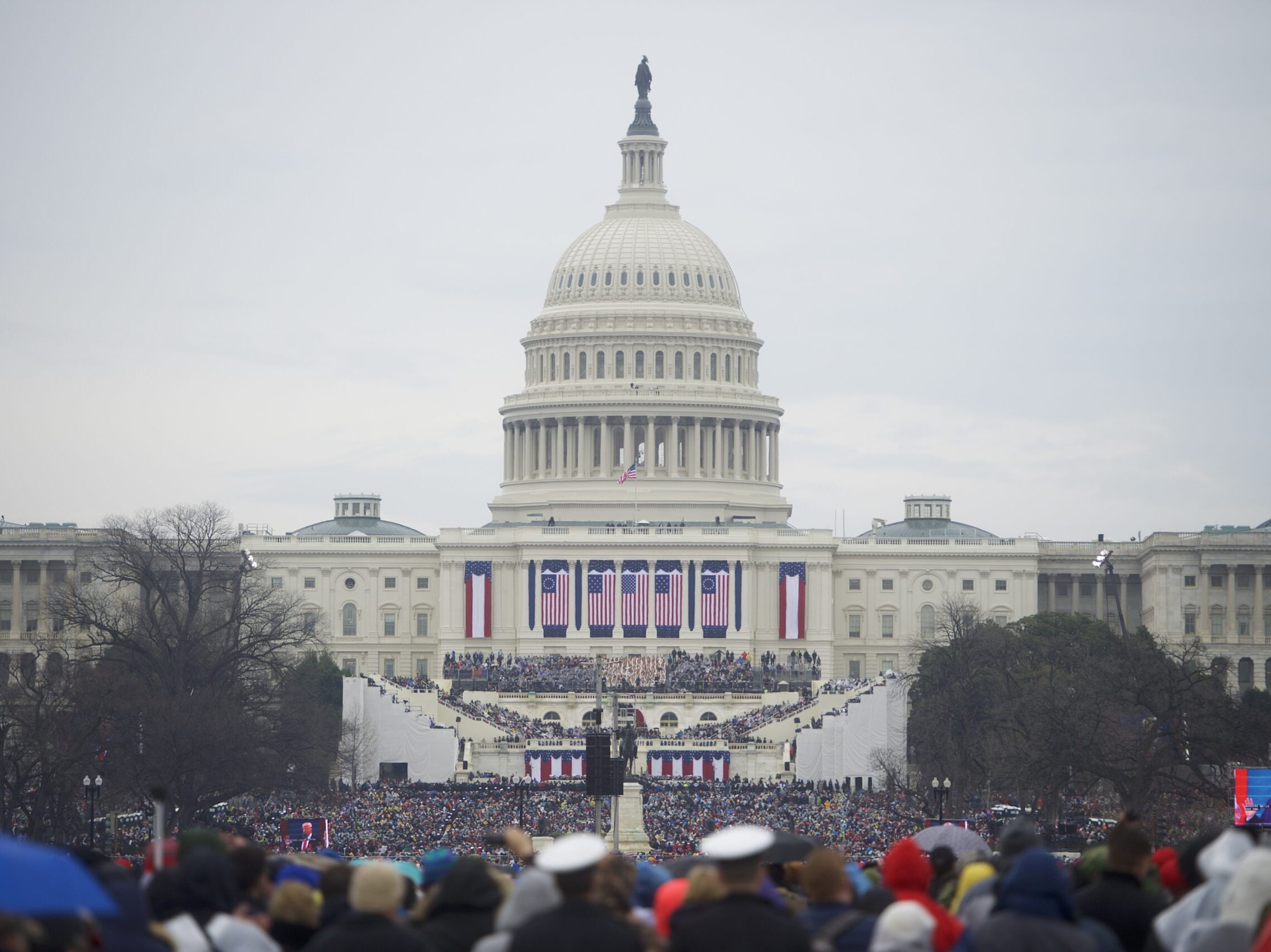 WASHINGTON, DC - JANUARY 20:  Supporters arrive before the inauguration of Donald Trump being sworn in as the 45th President of the United States in front of the U.S. Capitol Building on the National Mall January 20, 2017 in Washington D.C.  Hundreds of thousands of people attended to celebrate and protest.  (Photo by Mark Makela/Getty Images)