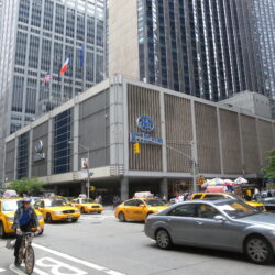 Looking southwest down 6th Avenue and across 54th Street at Hilton on a cloudy afternoon.